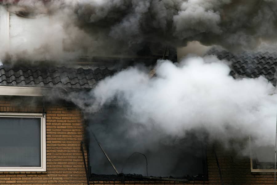 Fire damage restoration Huntington Beach — smoke and soot damaged interior being restored